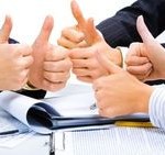 People with their thumbs up meaning a great business plan